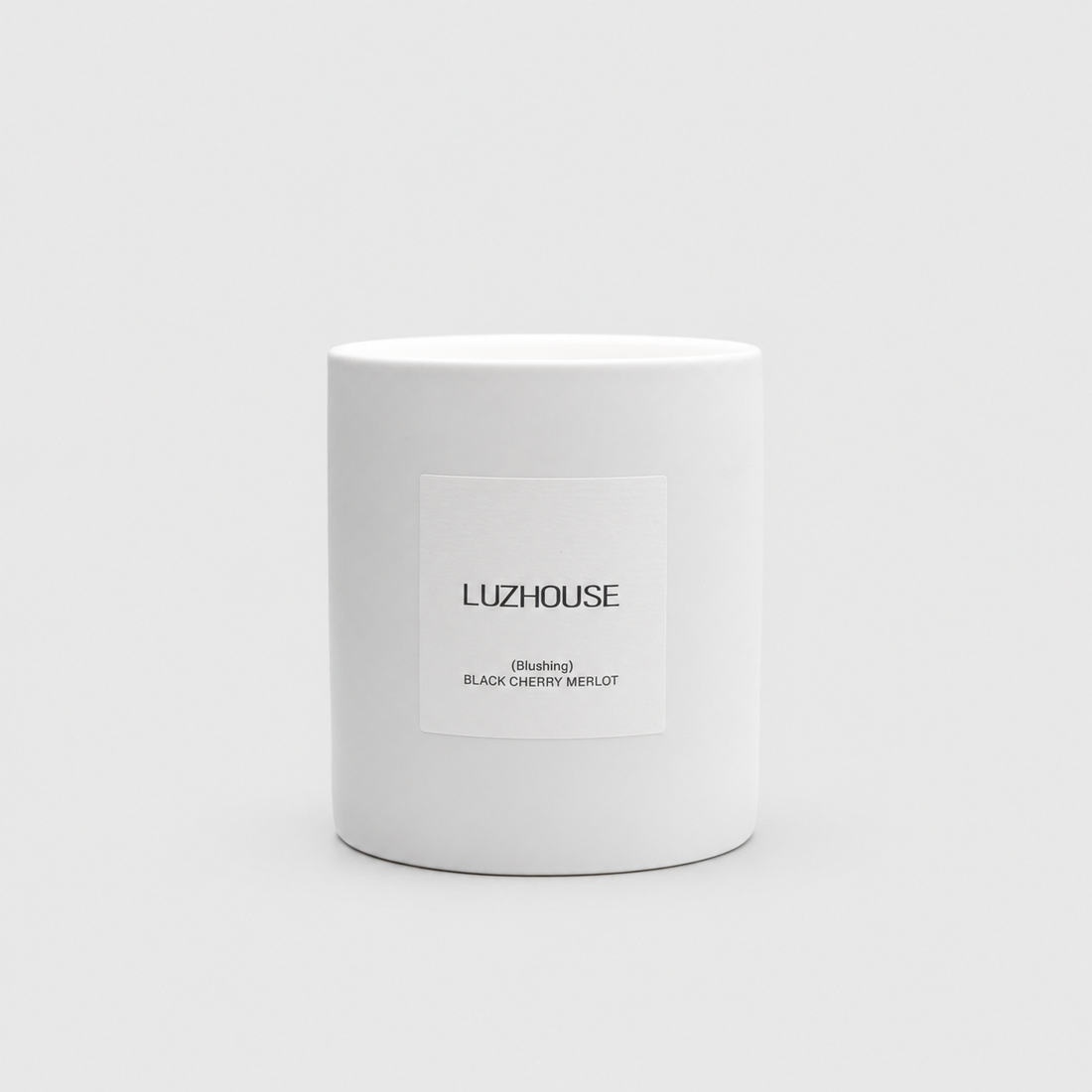Blushing Candle on a light gray background